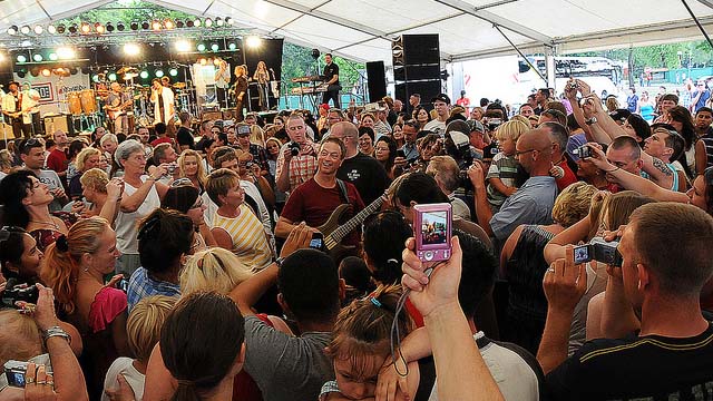 fans surrounding musician