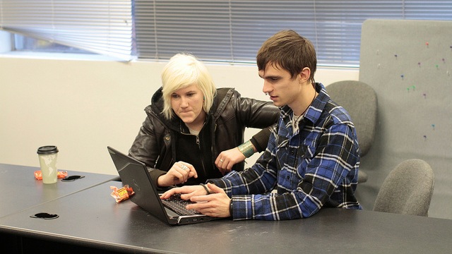 pair at laptop