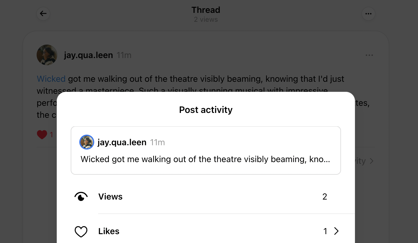 pop-up window showing post activity on Threads with the number of views and likes