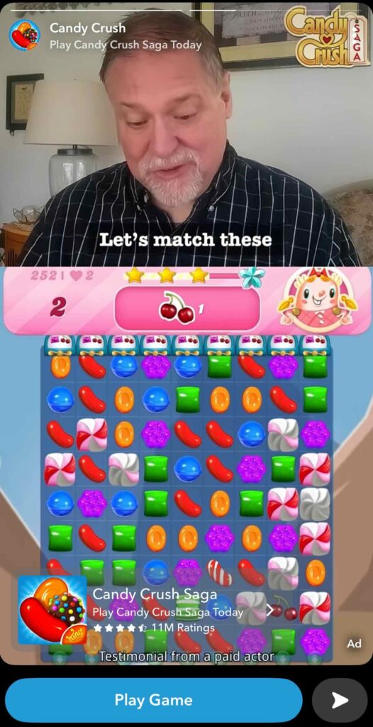 A Snapchat Story ad from Candy Crush featuring a testimonial from a paid actor as he plays the game.