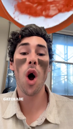 Snapchat AR Lens showing a user mid-dunk, right before the orange Gatorade splashes from the virtual cooler.