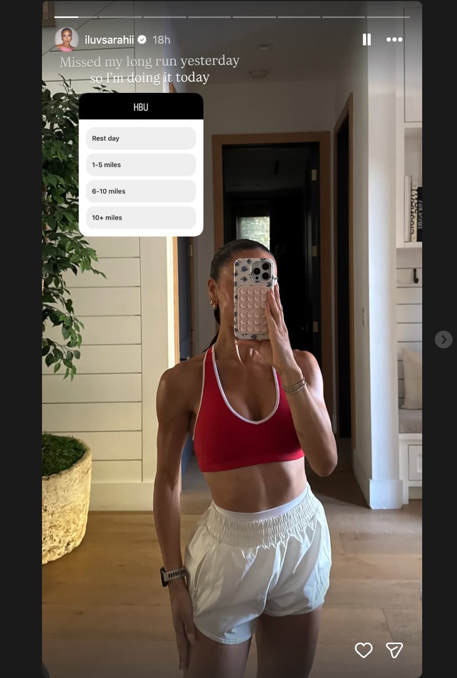Influencer taking a mirror selfie with a running outfit and a poll asking "HBU?"