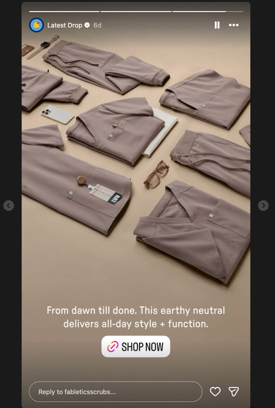 Instagram Story from Fabletics Scrubs showing several clothing items laid out on the floor with a caption that reads "From dusk till done. This earthy neutral delivers all-day style + function"
