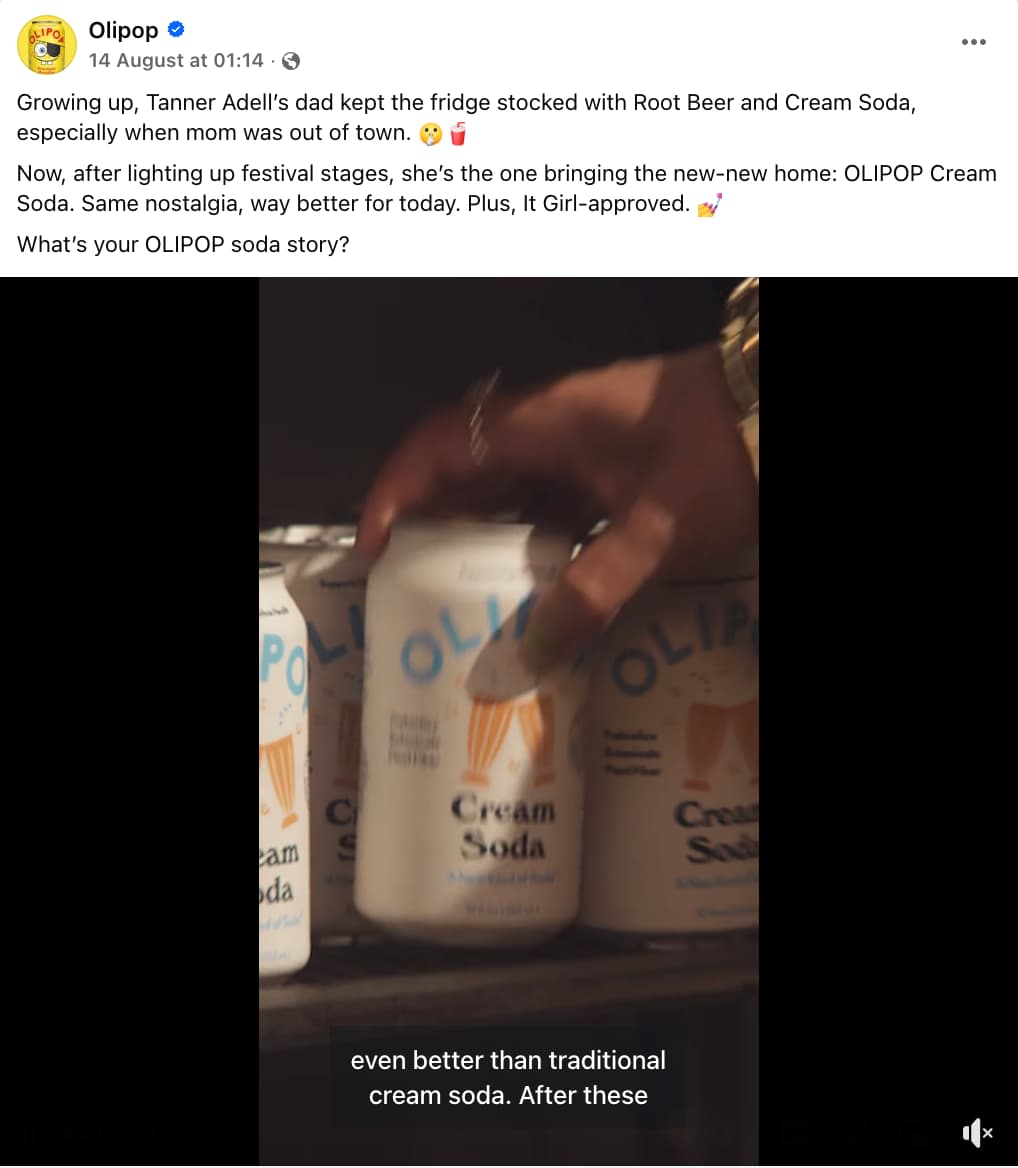 OLIPOP Facebook post showing hands picking out a can of its Cream Soda from a shelf stacked with other cans and a caption that tells the story of Tanner Adell's childhood.