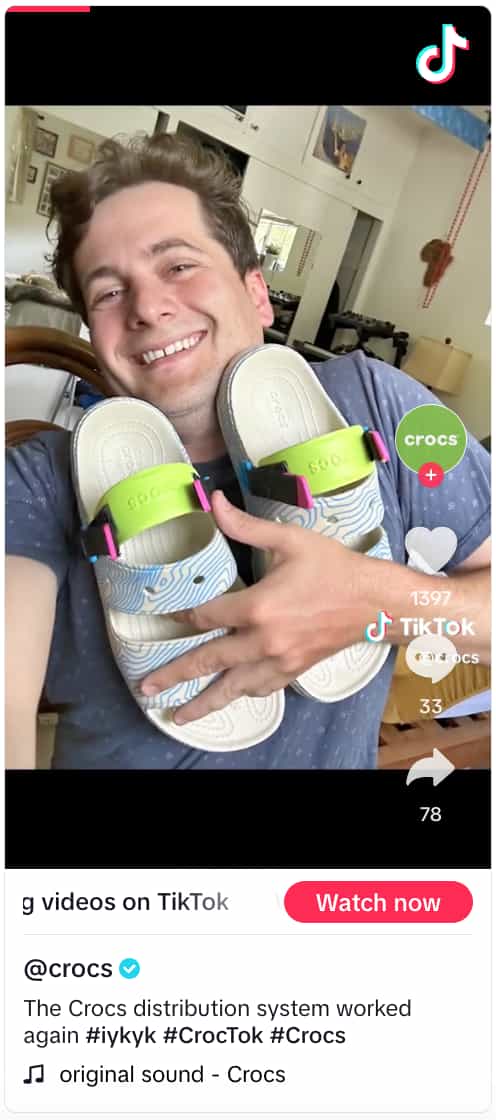 Video from Crocs showing a person holding a pair of Crocs to their chest and smiling at the camera