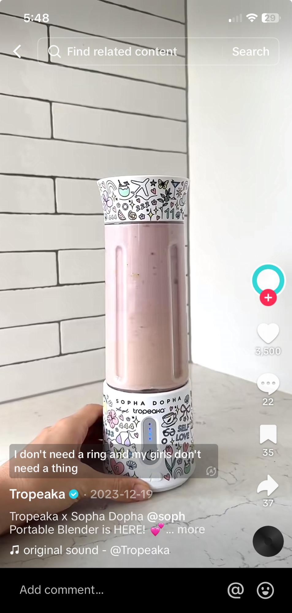 A Tropeaka and Sopha Dopha TikTok collab shows a hand holding Tropeaka’s white portable blender with Sopha Dopha’s name