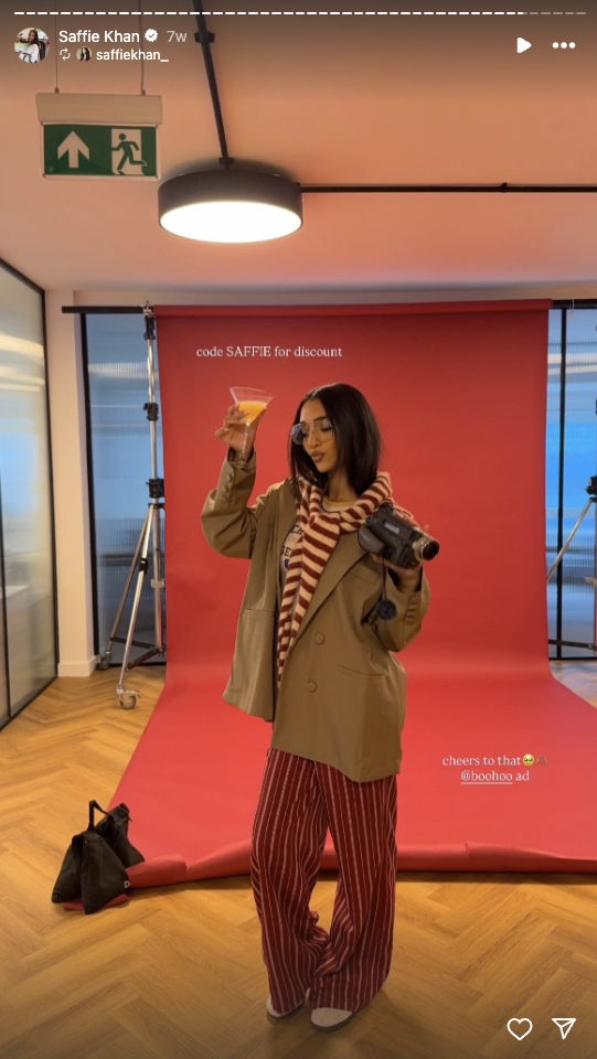 Boohoo Instagram Story shows influencer @saffiekhan_ backstage at an ad shoot, sharing a discount code for followers.