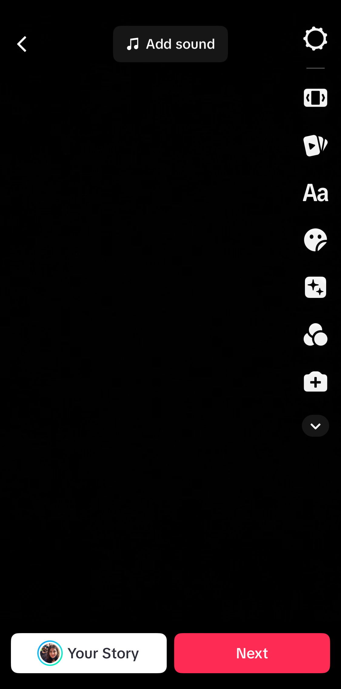A black screen showing the TikTok editing screen with options to add sound, text, stickers, and effects.