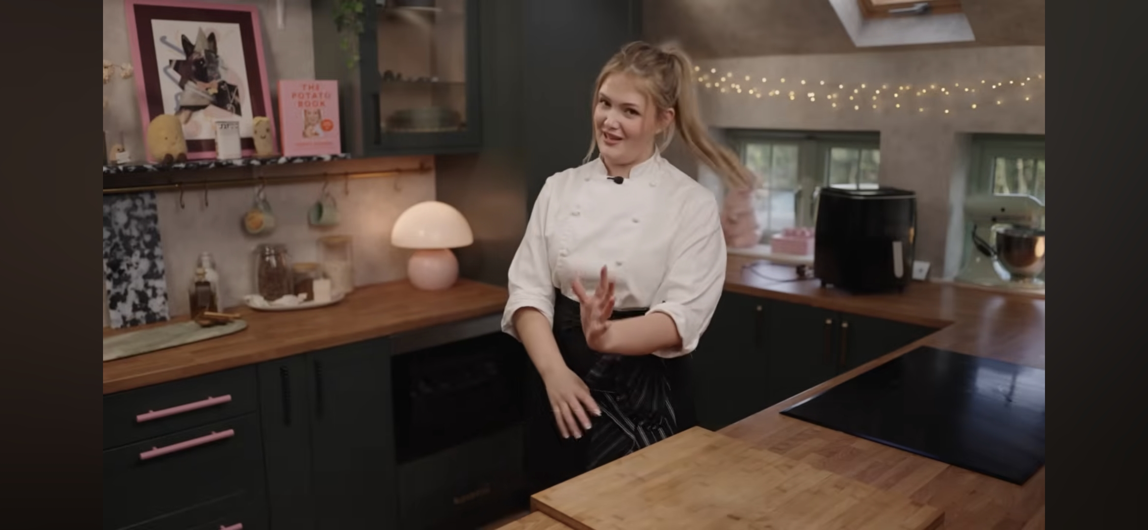Poppy O'Toole in a kitchen setting on her YouTube channel.