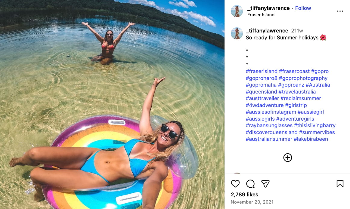 An Instagram photo of Tiffany lying in a bright inflatable pool ring while floating in a Fraser Island lagoon