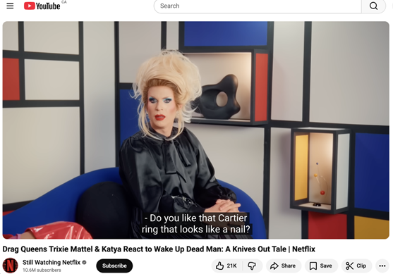 A YouTube video from Netflix featuring drag queens Trixie and Katya where they’re reviewing the Netflix movie, Wake Up Dead Man: A Knives Out Tale.