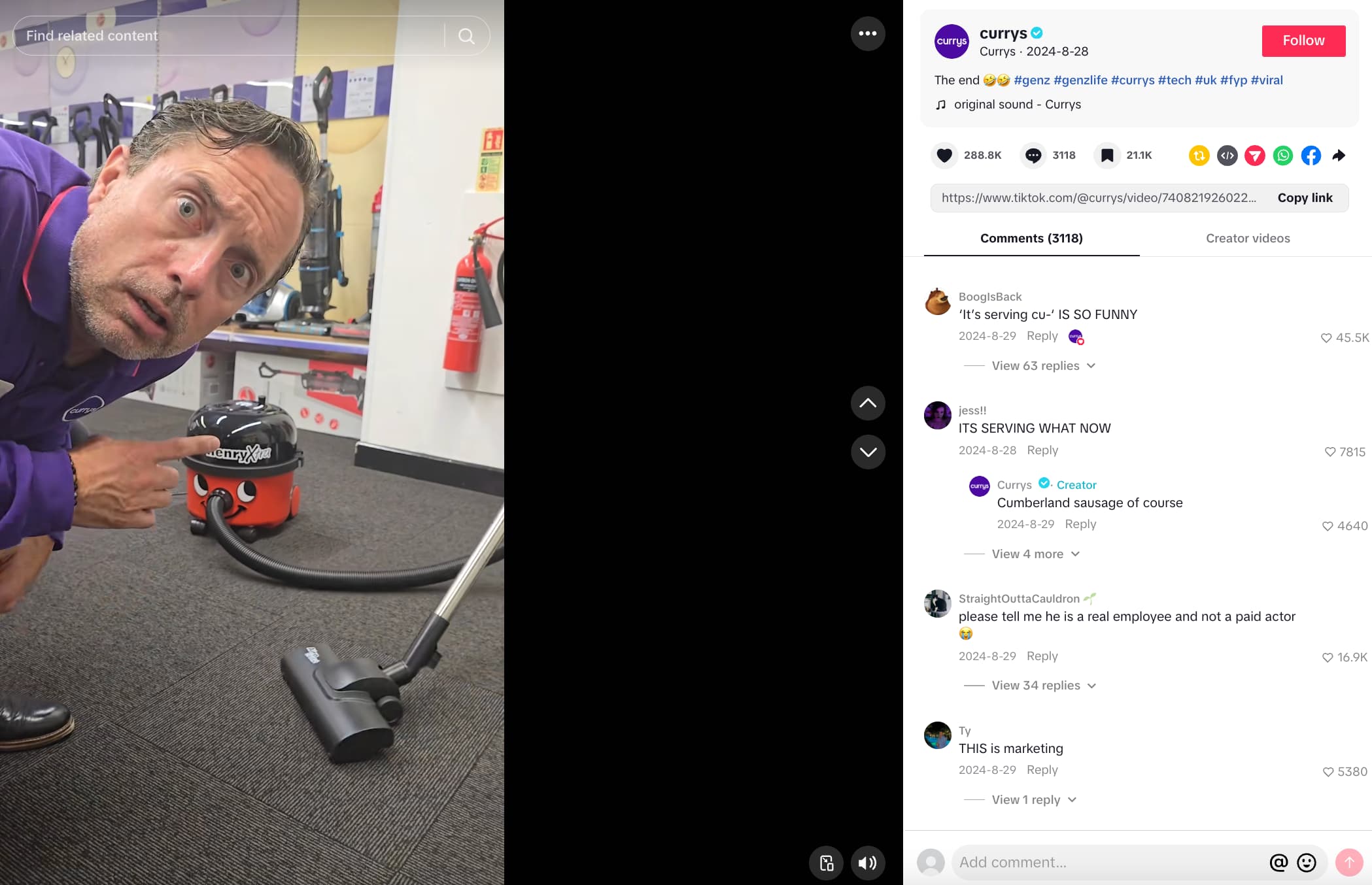 Man in a Currys uniform looking at the camera and pointing at a vacuum cleaner on the floor