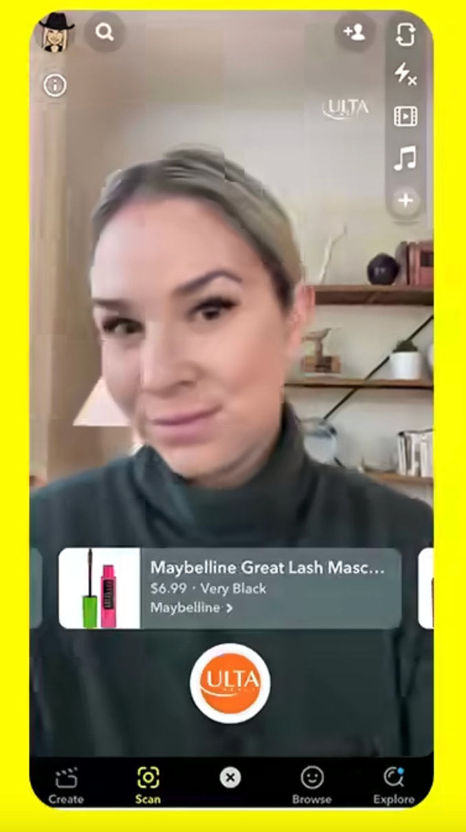 Snapchat filter showing a woman trying on Maybelling mascara and a product link displaying at the bottom of the screen