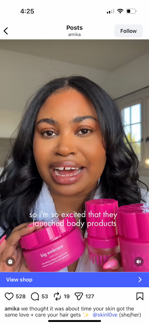 Instagram shoppable post by Amika showing a person holding the brand's products in front of the camera as she explains them