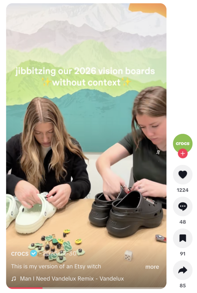 A video from the Crocs account of team members building their vision boards using Crocs and accessories