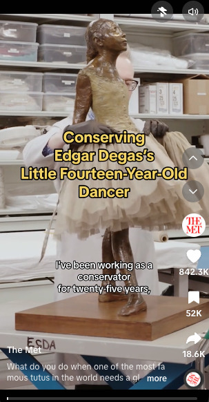 Conservator examines Degas's "Little Fourteen-Year-Old Dancer" sculpture, wrapped in its tutu, during restoration work.