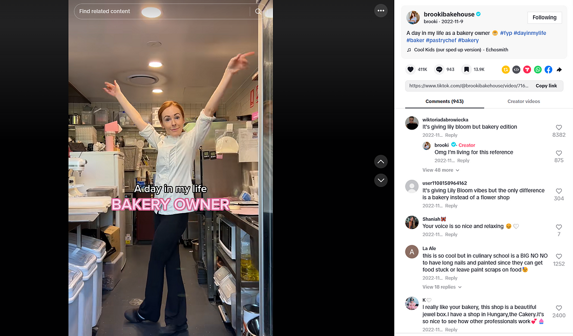A TikTok post from the account Brooki Bakehouse. A woman in a chef’s jacket holds her hands in the air, and the text overlay reads ‘A day in my life bakery owner’.